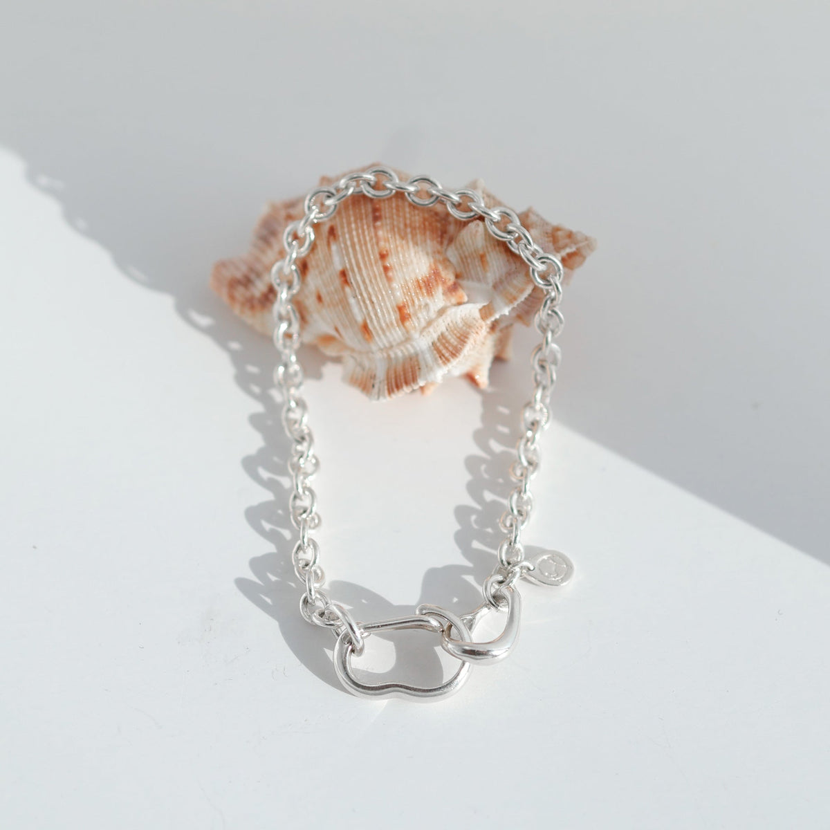 Bubble Carabiner Bracelet styled with a shell