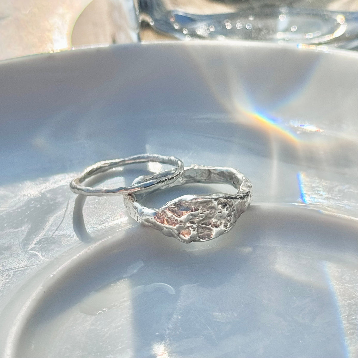 Lintier molten sterling silver rings shown together