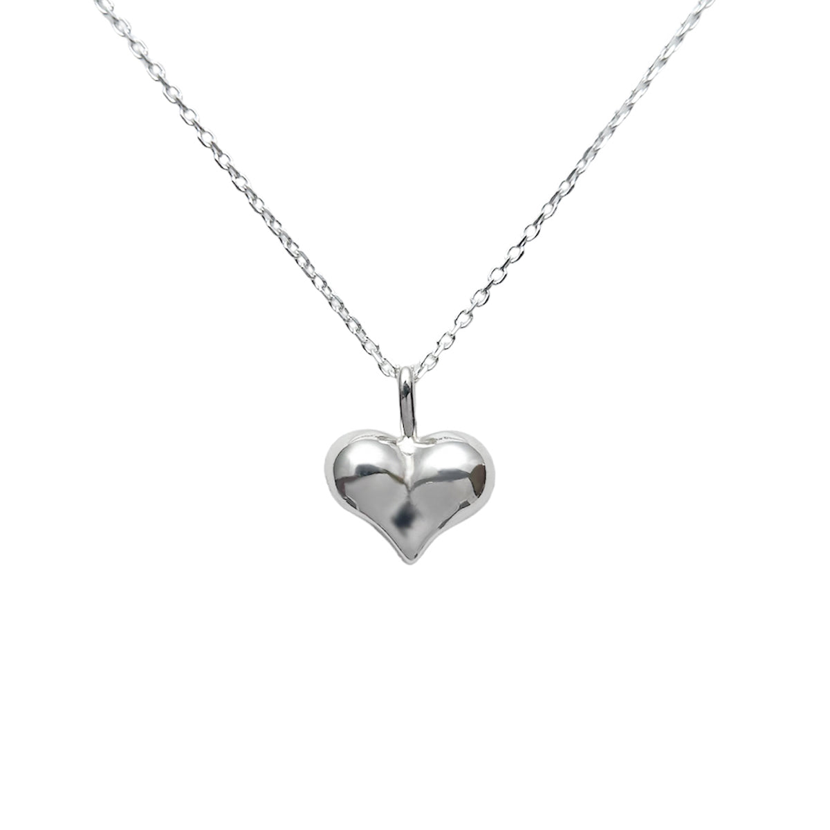Cheeky Big Heart Necklace, a puffed sterling silver heart pendant on a fine silver chain
