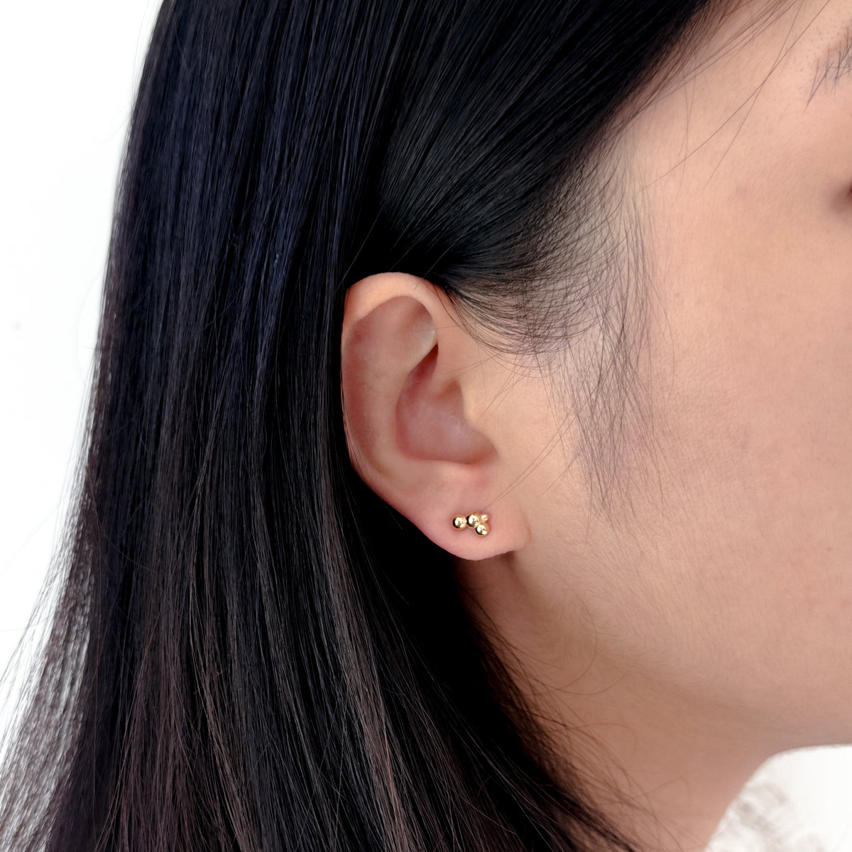 Cloud Studs in 14k gold worn