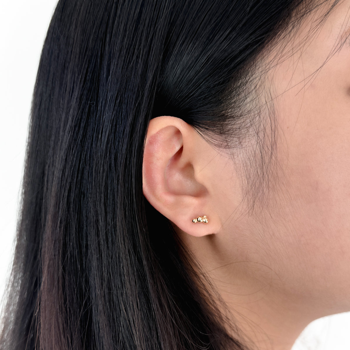 Dream Studs in 14k gold worn