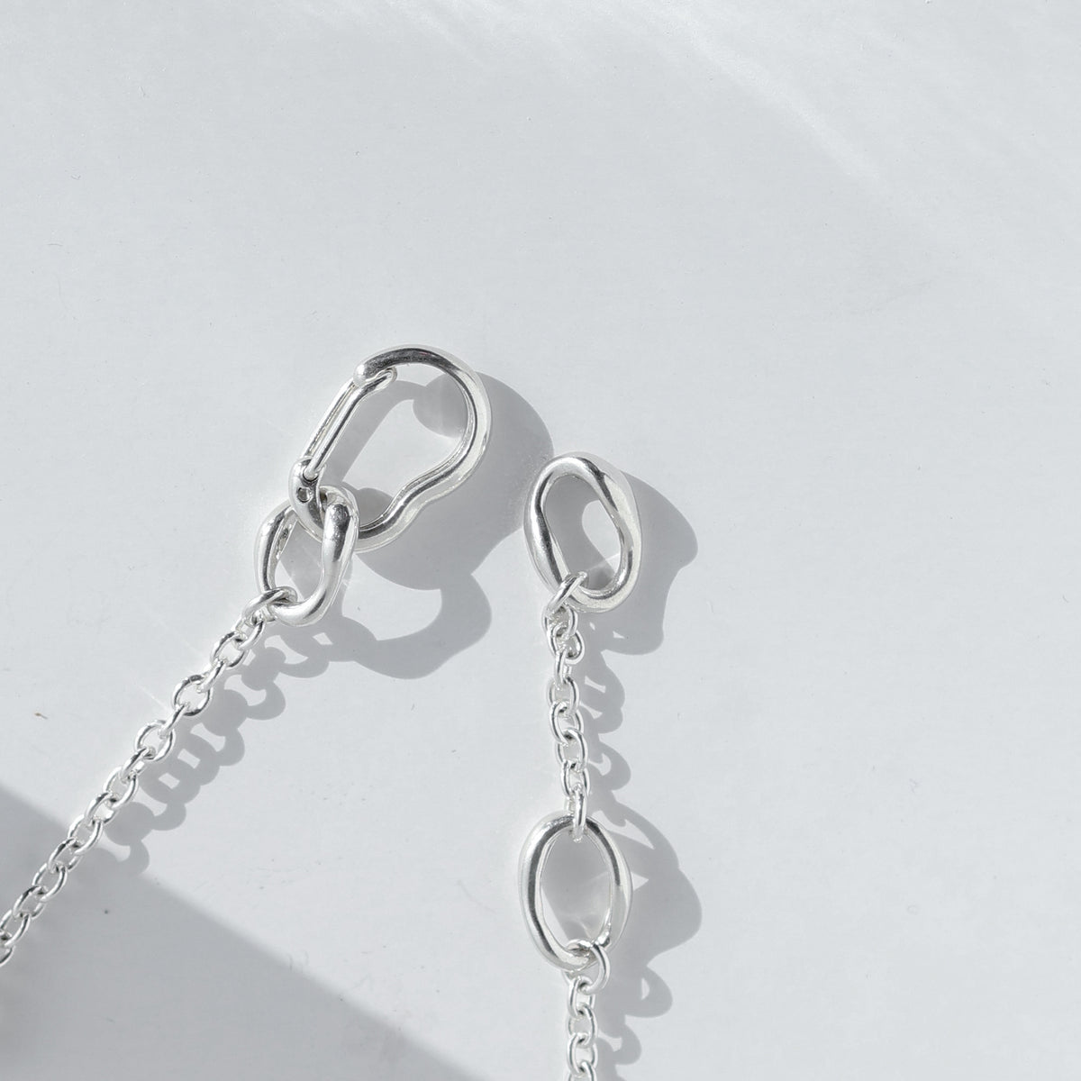 Close detail of the sterling silver carabiner clasp