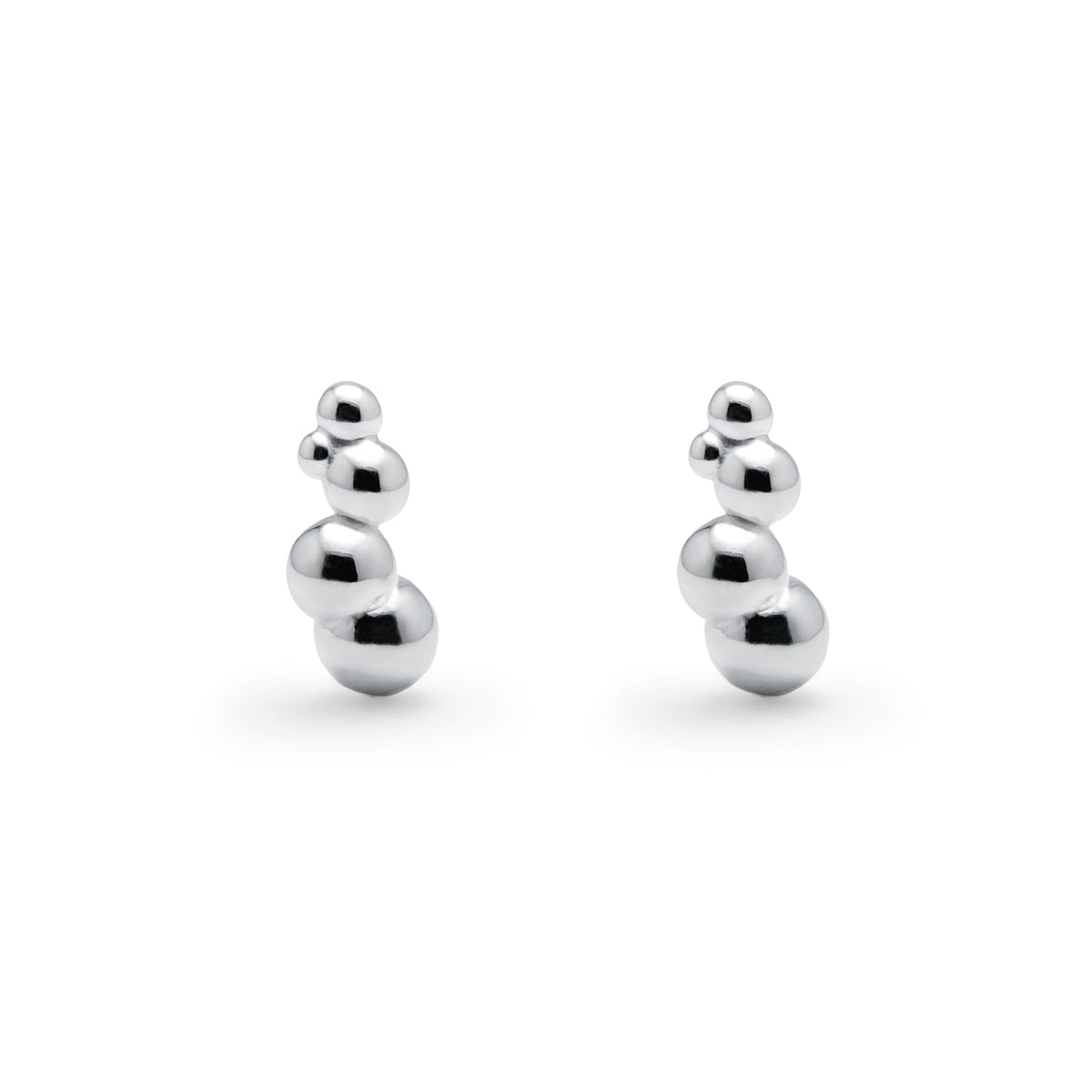Drip Studs, sterling silver earrings with three graduated silver spheres in a vertical line