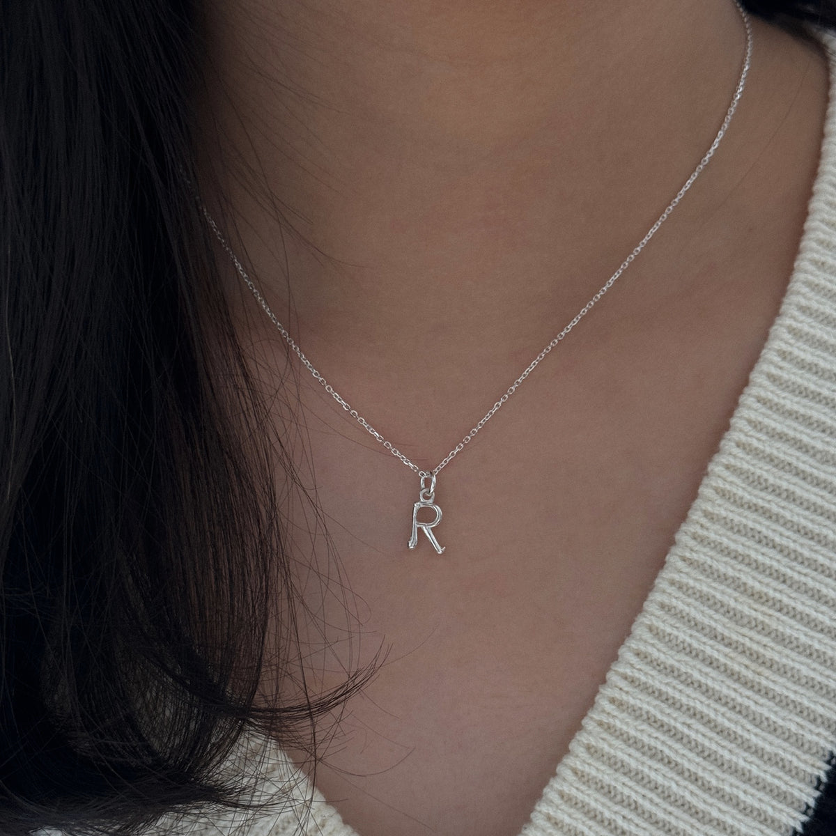 Yours Truly Initial necklace worn, close view