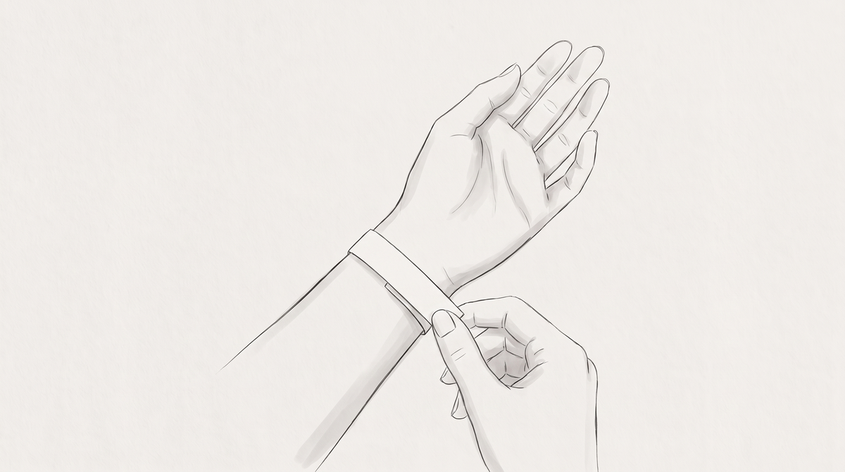 A strip of paper wrapped around the wrist