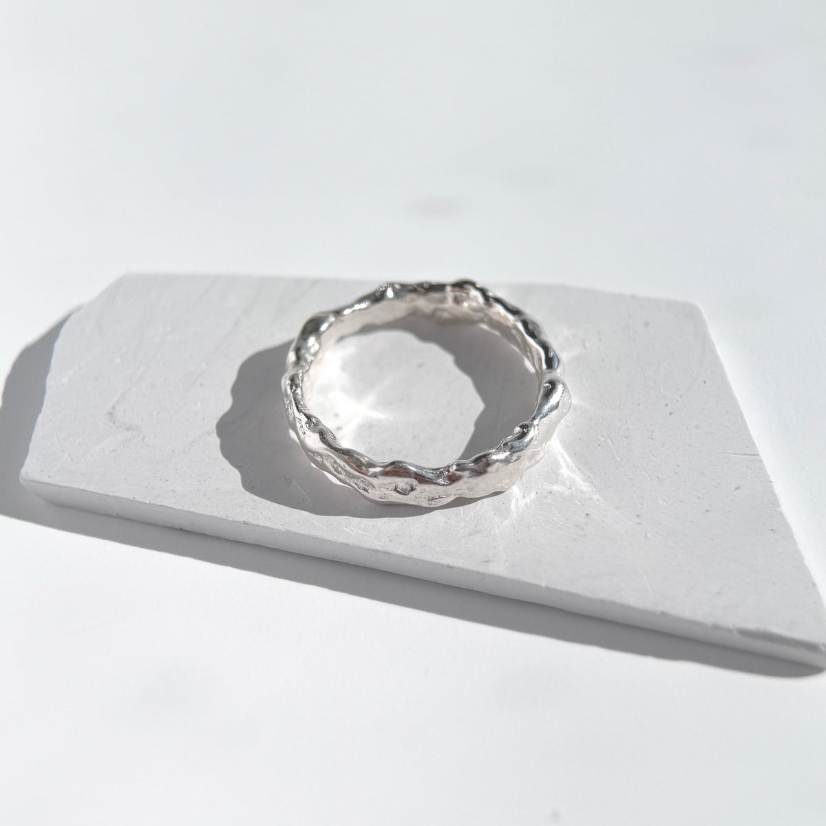 Molten Band Ring, textured sterling silver band seen from another angle