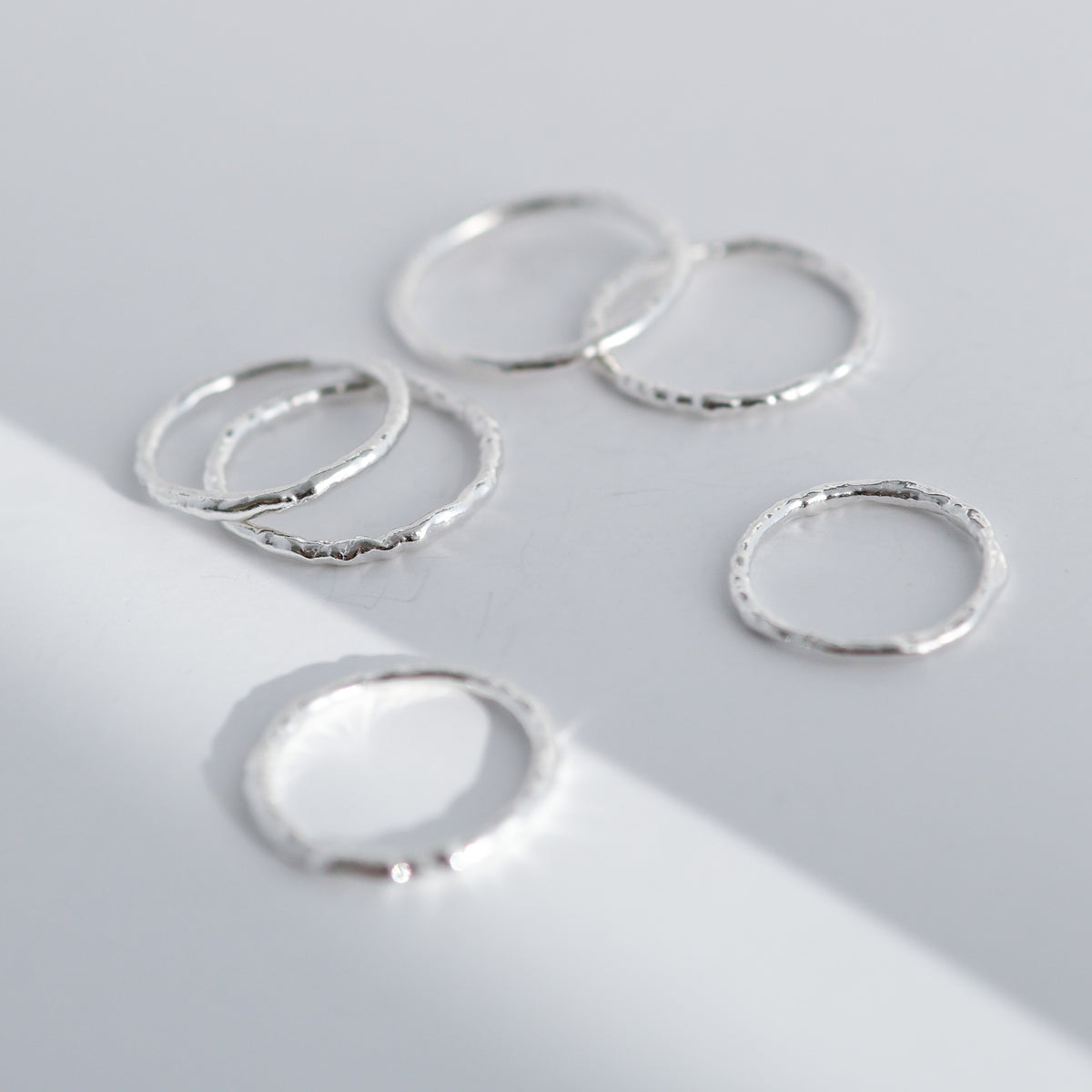 Molten Line Rings in sterling silver, several bands shown together