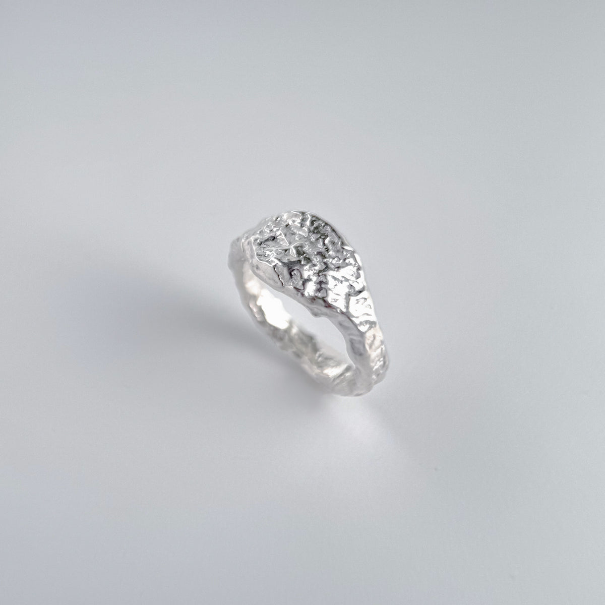 Molten Signet Ring, a sterling silver signet ring with a heavily textured molten face