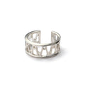 Orbit Ring, a wide open sterling silver cuff ring with a cut out pattern of orbiting loops