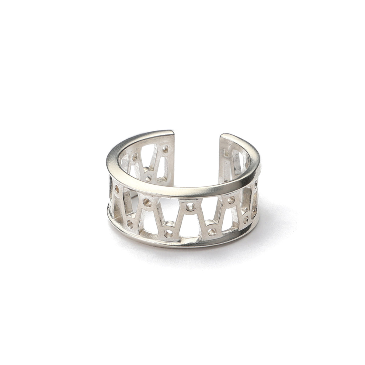Orbit Ring, a wide open sterling silver cuff ring with a cut out pattern of orbiting loops