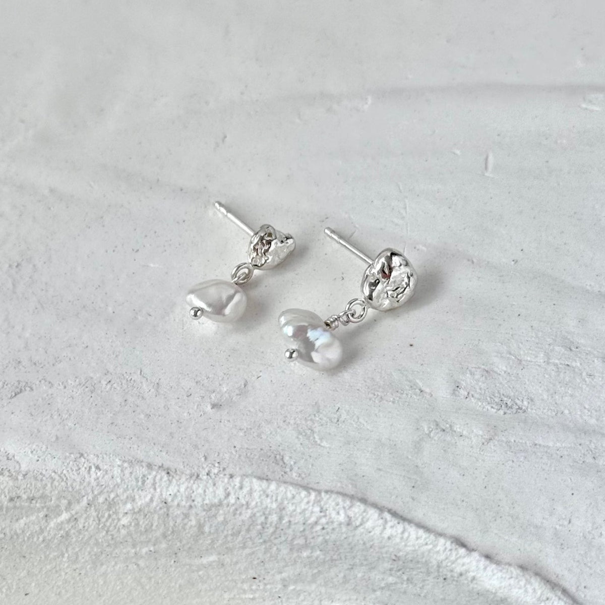 Molten Pearl Earrings styled with other Lintier silver pieces