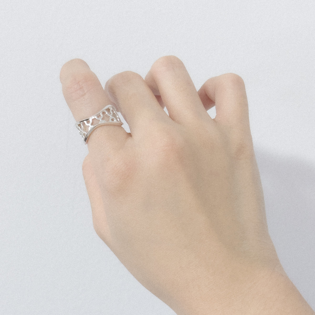 Ripple Ring worn on the hand