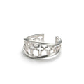 Starlight Ring, an open sterling silver cuff ring with small stars cut through the band