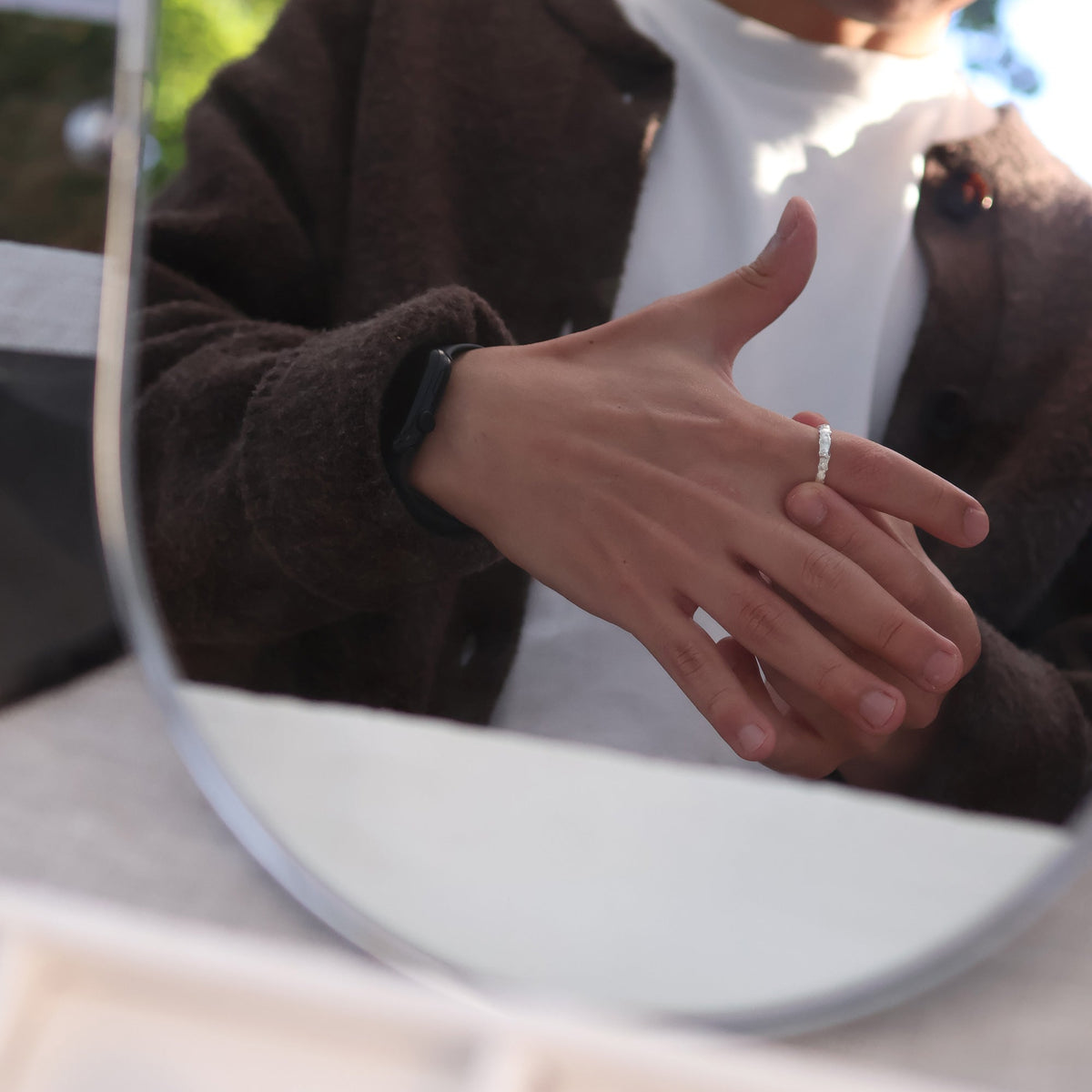 Molten Band Ring worn on the hand
